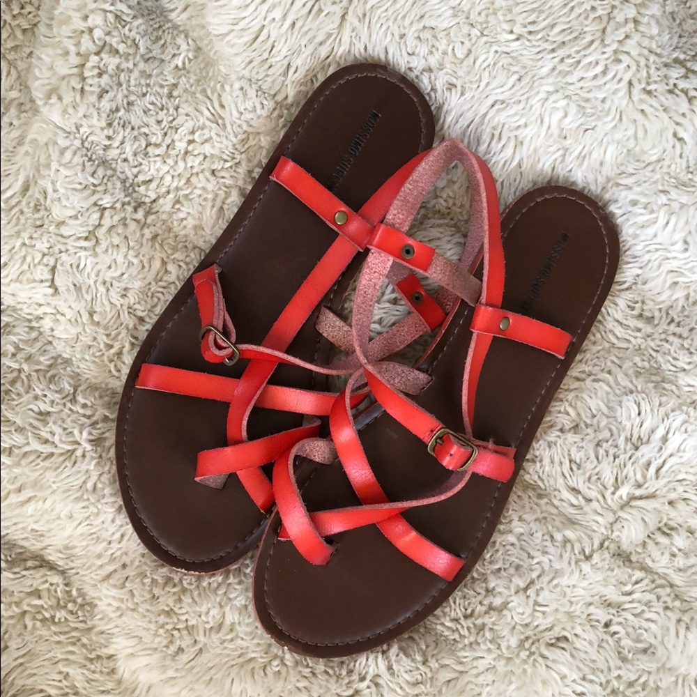Red strappy flip flop sandals